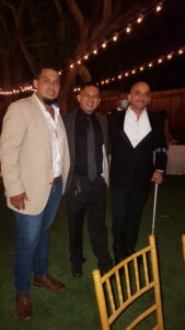 Victor, Melvin, and I having a good time at a wedding