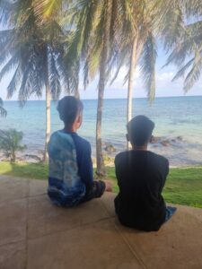 My two boys enjoying the view of beach 