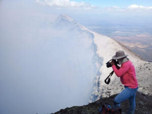 Man taking picture on the volcano inside