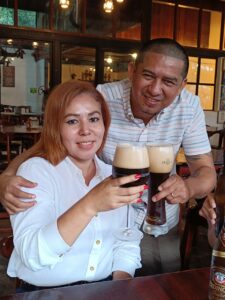 Cheering with a dark beer in Selva Negra