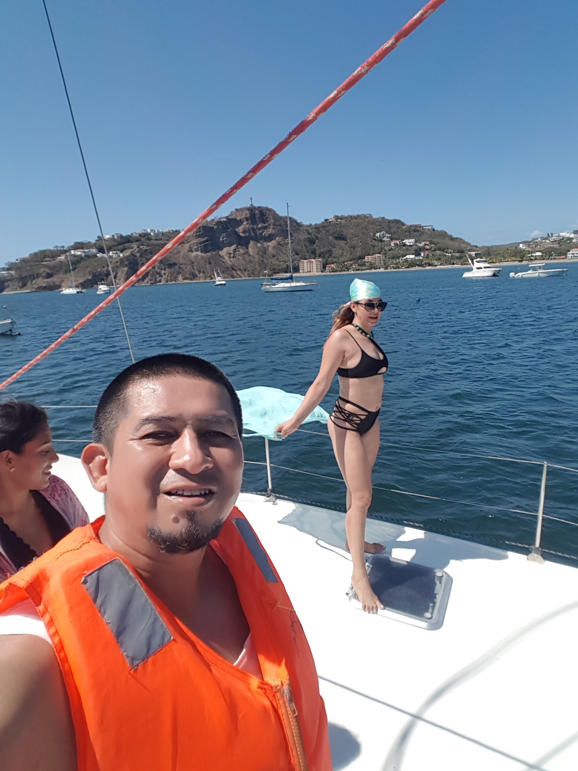 A woman posing as a model on The Catamaran San Juan del Sur.